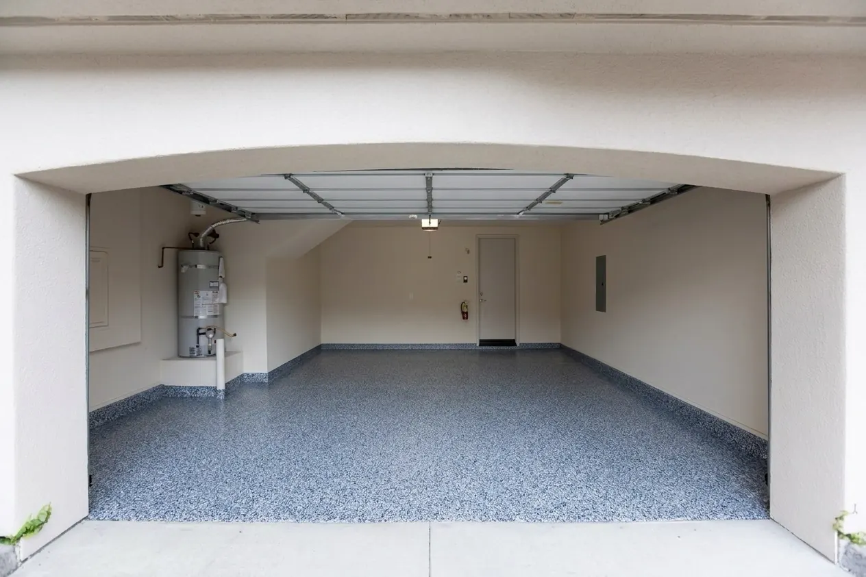 Two-car garage with a blue-gray flake floor
