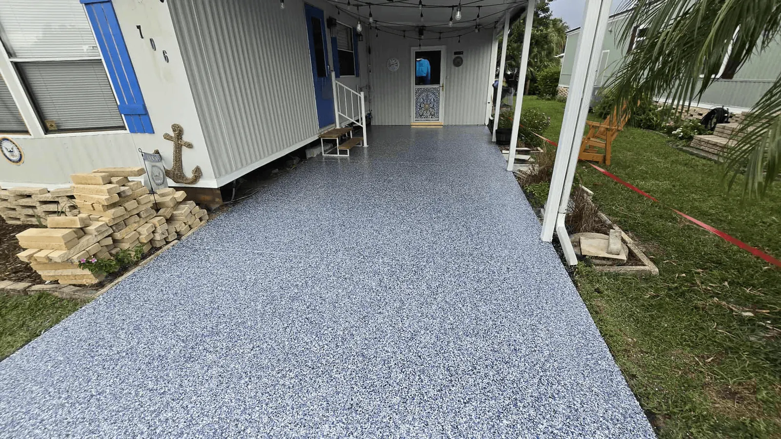 Covered walkway with a blue-gray flake floor